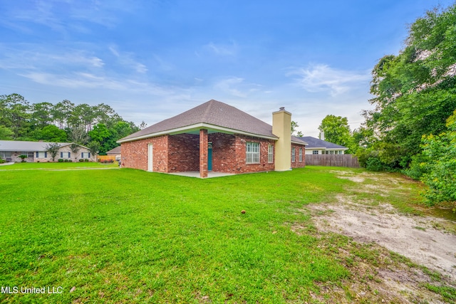 725 Old Savannah Dr, Long Beach, MS 39560 - back of property featuring brick siding and a chimney