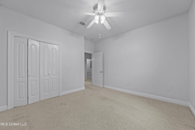 725 Old Savannah Dr, Long Beach, MS 39560 - unfurnished bedroom featuring carpet flooring, a closet, baseboards, and ceiling fan