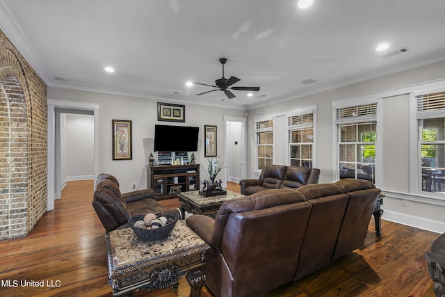 living room with crown molding, dark hardwood / wood-style floors, and ceiling fan