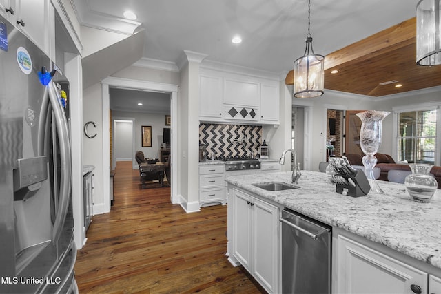 kitchen featuring decorative backsplash, appliances with stainless steel finishes, dark hardwood / wood-style floors, and white cabinets