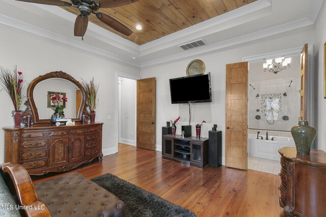 living room featuring wood ceiling, hardwood / wood-style floors, a tray ceiling, and ceiling fan with notable chandelier