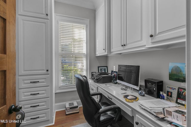 office space with ornamental molding and wood-type flooring