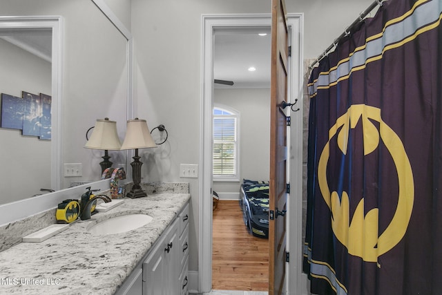 bathroom with vanity and hardwood / wood-style floors