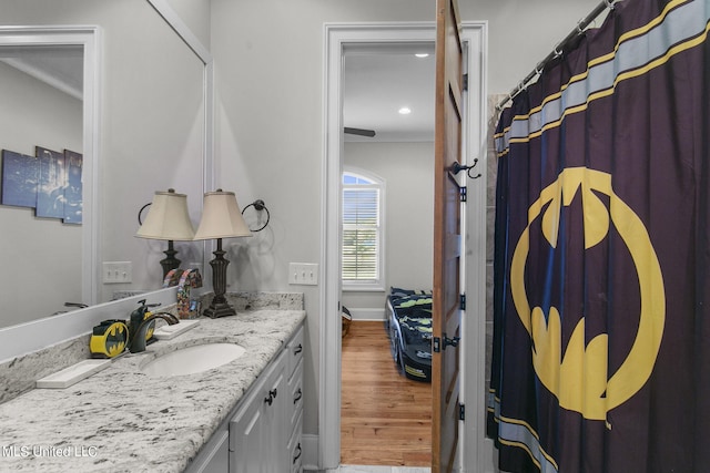 213 Ironwood Plantation Blvd, Madison, MS 39110 - bathroom with crown molding, wood finished floors, vanity, baseboards, and recessed lighting