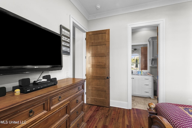 bedroom featuring ornamental molding and dark wood-type flooring