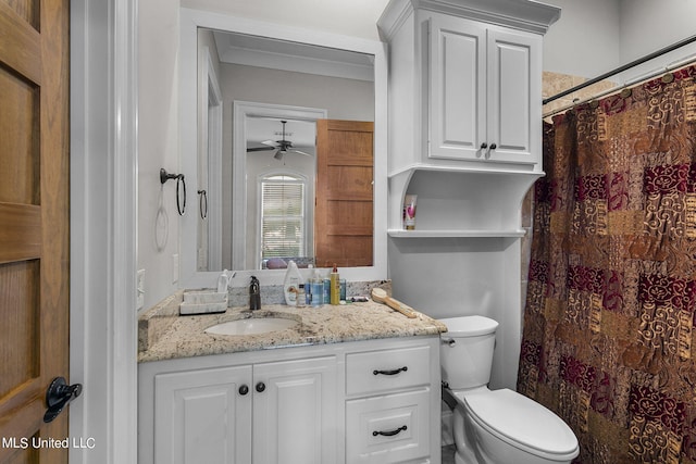 bathroom with vanity, toilet, a shower with shower curtain, and ceiling fan