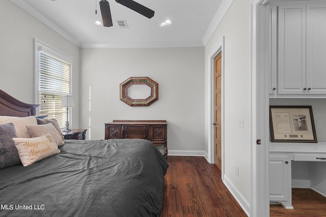 bedroom with dark hardwood / wood-style flooring, crown molding, built in desk, and ceiling fan