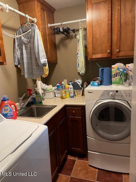 806 Viney Ridge Rd, Clarksdale, MS 38614 - clothes washing area with cabinet space, independent washer and dryer, and tile patterned floors