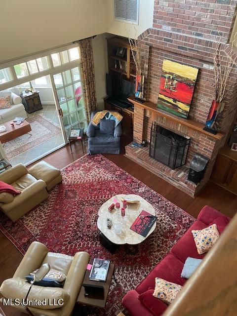 806 Viney Ridge Rd, Clarksdale, MS 38614 - living room featuring wood finished floors and a fireplace