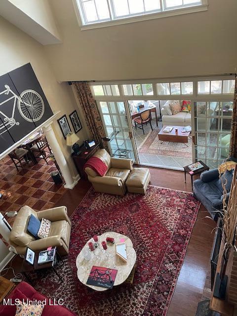 806 Viney Ridge Rd, Clarksdale, MS 38614 - living area featuring a high ceiling, healthy amount of natural light, and wood finished floors