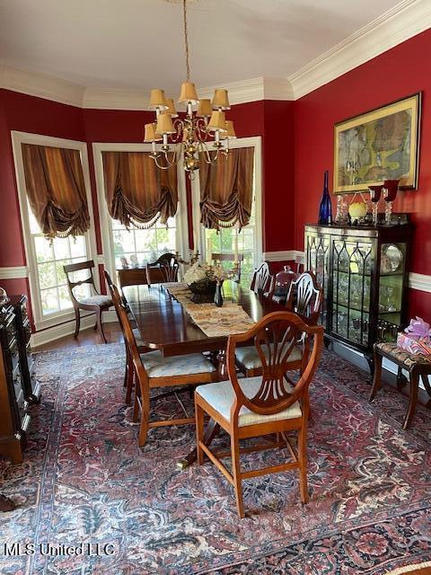 806 Viney Ridge Rd, Clarksdale, MS 38614 - dining area featuring a chandelier and ornamental molding