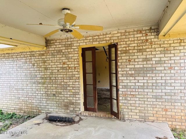 55 Amacker Rd, Poplarville, MS 39470 - doorway to property with ceiling fan and brick siding
