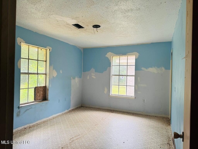55 Amacker Rd, Poplarville, MS 39470 - unfurnished room featuring a textured ceiling