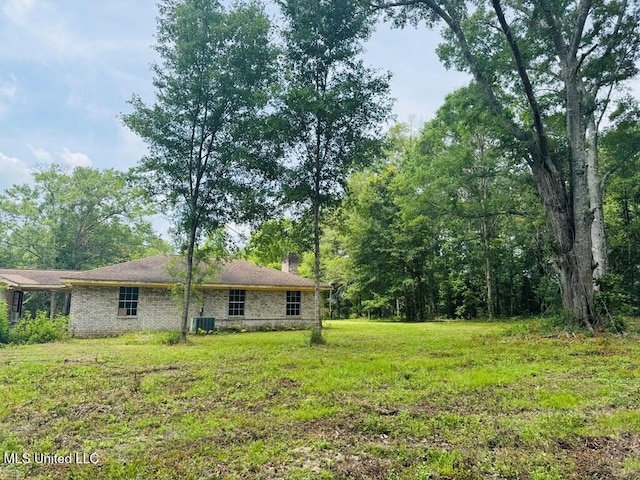 55 Amacker Rd, Poplarville, MS 39470 - view of grassy yard with central air condition unit