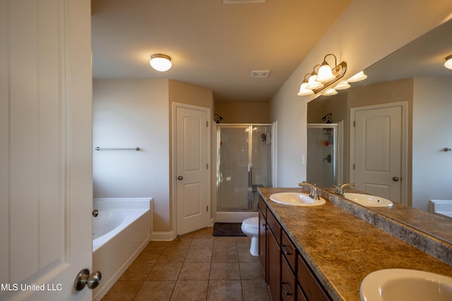 full bathroom featuring tile patterned floors, vanity, independent shower and bath, and toilet