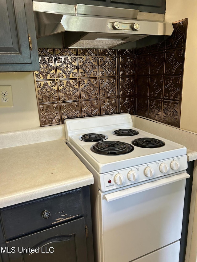 150 Lakeside Villa Unit J, Diamondhead, MS 39525 - kitchen featuring white electric stove, extractor fan, light countertops, and dark cabinets