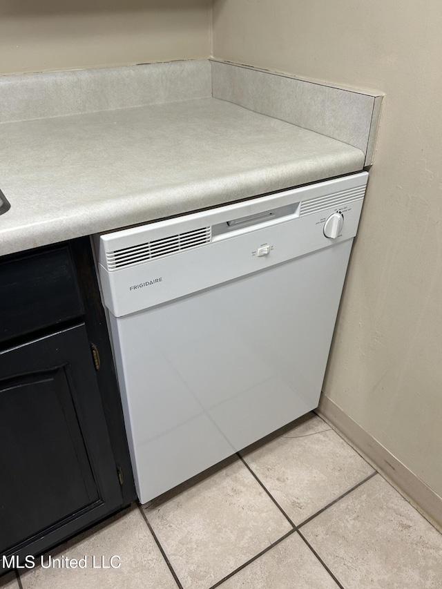 150 Lakeside Villa Unit J, Diamondhead, MS 39525 - kitchen view of dishwasher, dark cabinetry, baseboards, and light countertops