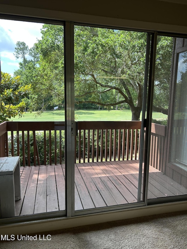 150 Lakeside Villa Unit J, Diamondhead, MS 39525 - deck featuring view of scattered trees and a lawn