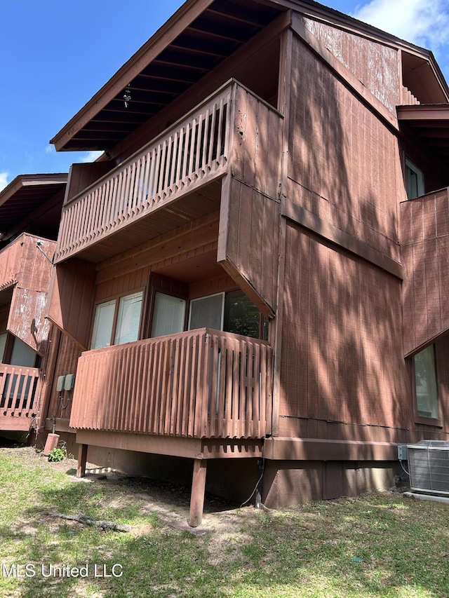 150 Lakeside Villa Unit J, Diamondhead, MS 39525 - view of side of property with cooling unit and a balcony