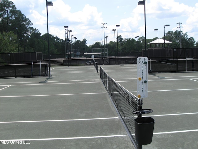 150 Lakeside Villa Unit J, Diamondhead, MS 39525 - view of tennis court featuring fence