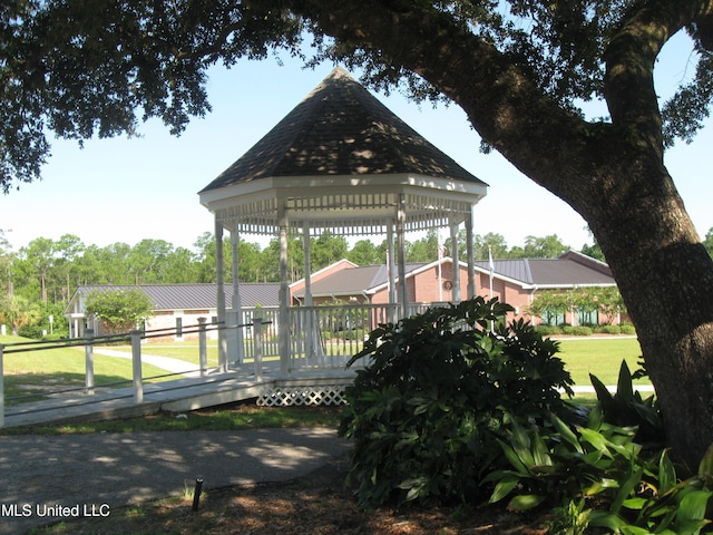 150 Lakeside Villa Unit J, Diamondhead, MS 39525 - dock featuring a gazebo, a lawn, and a deck