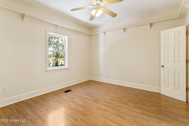 spare room featuring ceiling fan and hardwood / wood-style flooring