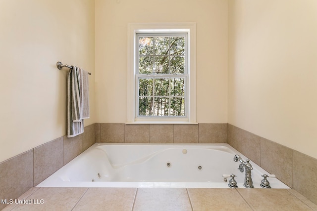 bathroom featuring a relaxing tiled tub