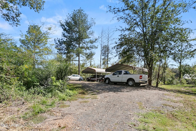 view of parking with a carport