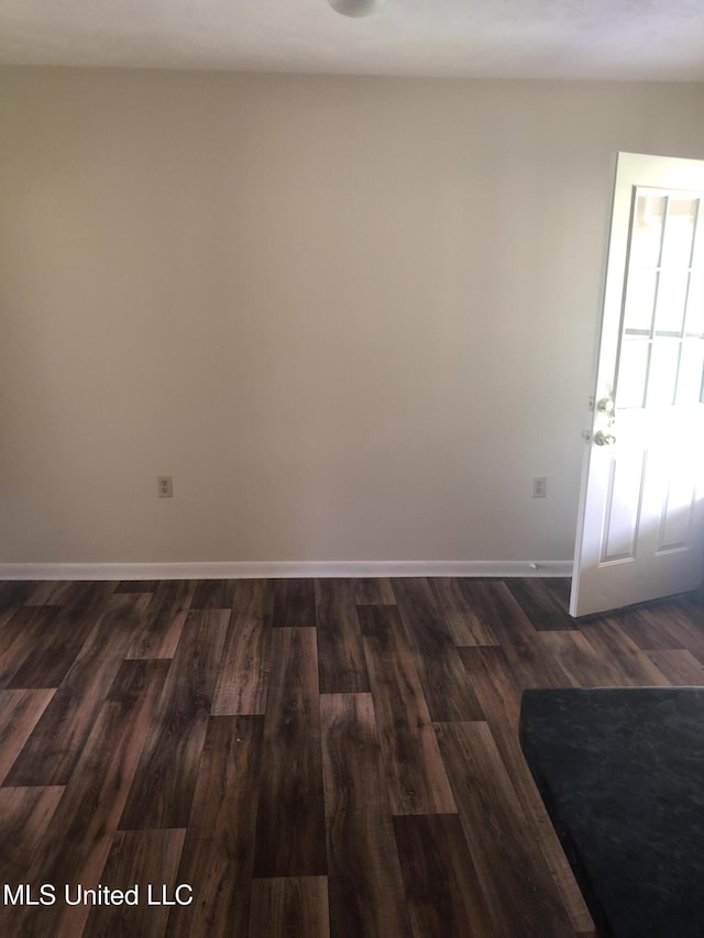 69 Wiley Ave, Durant, MS 39063 - unfurnished room with dark wood-style flooring and baseboards