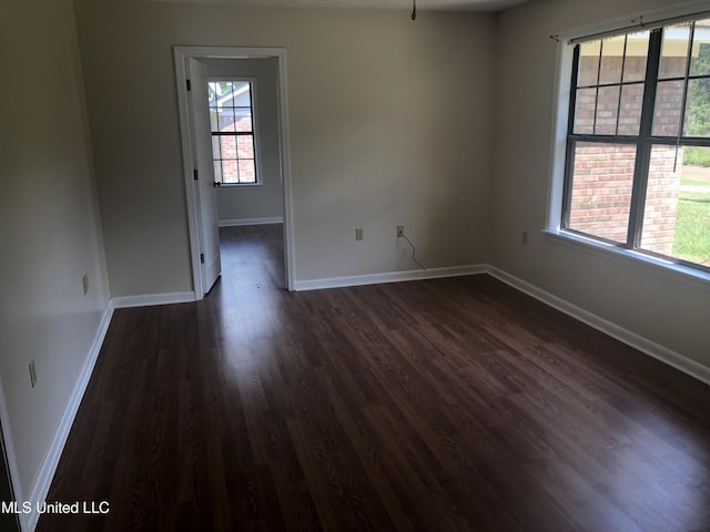 69 Wiley Ave, Durant, MS 39063 - unfurnished room featuring dark wood-type flooring and baseboards