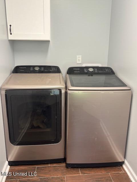 81 Hickory, Byhalia, MS 38611 - laundry room featuring washer and clothes dryer and cabinet space