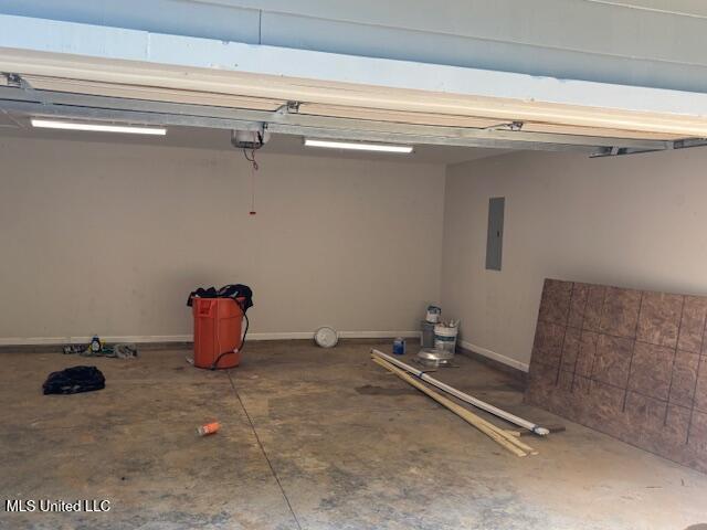81 Hickory, Byhalia, MS 38611 - garage with electric panel and a garage door opener