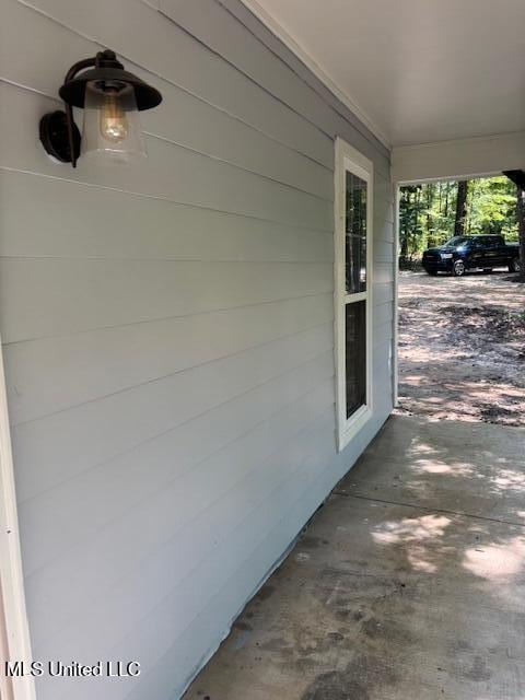 81 Hickory, Byhalia, MS 38611 - view of patio / terrace with a carport