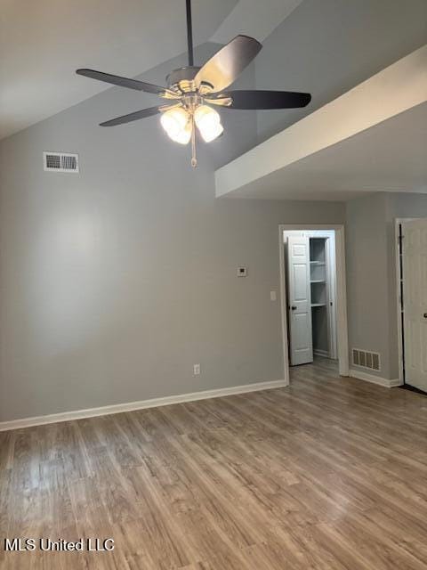 81 Hickory, Byhalia, MS 38611 - empty room featuring a ceiling fan, high vaulted ceiling, and wood finished floors