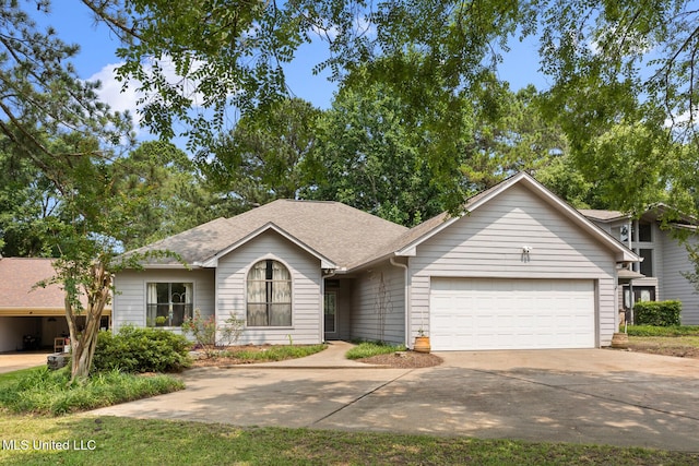 415 Spike Rdg, Canton, MS 39046 - view of front of home featuring an attached garage, concrete driveway, and a shingled roof