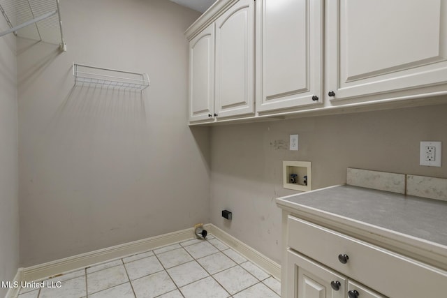 415 Spike Rdg, Canton, MS 39046 - washroom with hookup for a washing machine, cabinet space, baseboards, and light tile patterned flooring