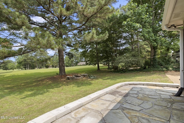 415 Spike Rdg, Canton, MS 39046 - view of grassy yard with a patio and a fire pit