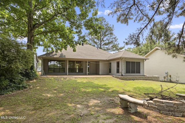 415 Spike Rdg, Canton, MS 39046 - rear view of property featuring an outdoor fire pit, a patio, a lawn, and roof with shingles