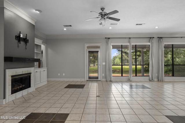 415 Spike Rdg, Canton, MS 39046 - unfurnished living room featuring healthy amount of natural light, a ceiling fan, light tile patterned floors, ornamental molding, and recessed lighting