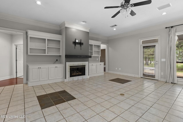 415 Spike Rdg, Canton, MS 39046 - unfurnished living room with a ceiling fan, light tile patterned floors, a fireplace, baseboards, and ornamental molding