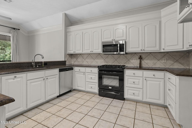 415 Spike Rdg, Canton, MS 39046 - kitchen featuring appliances with stainless steel finishes, a sink, white cabinets, light tile patterned floors, and ornamental molding