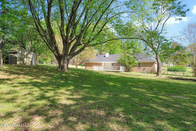 5415 Sollie Cv, Horn Lake, MS 38637 - view of yard featuring a storage shed and an outdoor structure