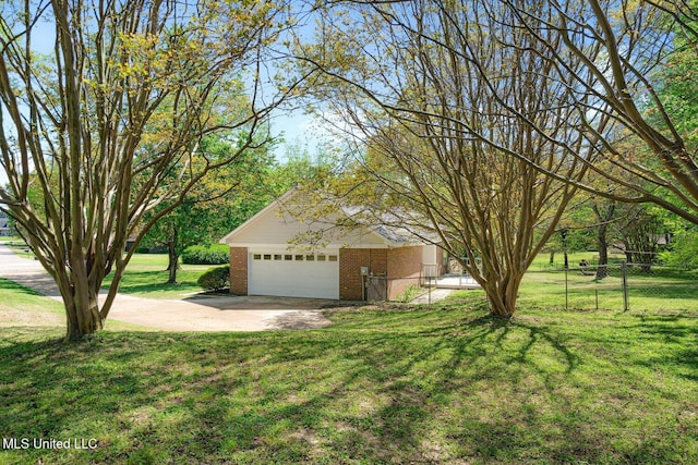 5415 Sollie Cv, Horn Lake, MS 38637 - exterior space featuring concrete driveway, fence, brick siding, a garage, and a front yard