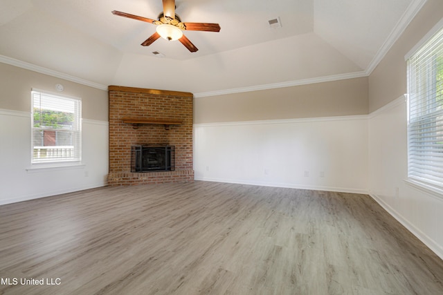 5415 Sollie Cv, Horn Lake, MS 38637 - unfurnished living room featuring wood finished floors, ceiling fan, a fireplace, ornamental molding, and a raised ceiling