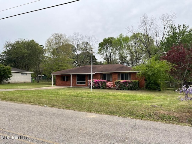 ranch-style house with a front yard