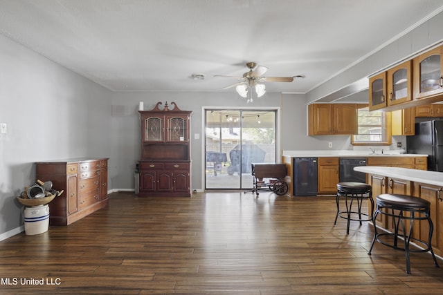 kitchen featuring light countertops, a ceiling fan, plenty of natural light, and black appliances
