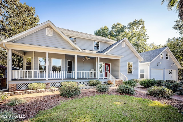 view of front facade with a porch, a garage, and a front lawn