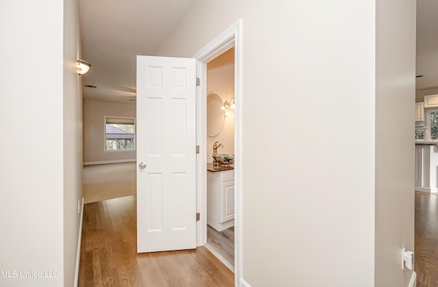 hallway featuring light wood-type flooring