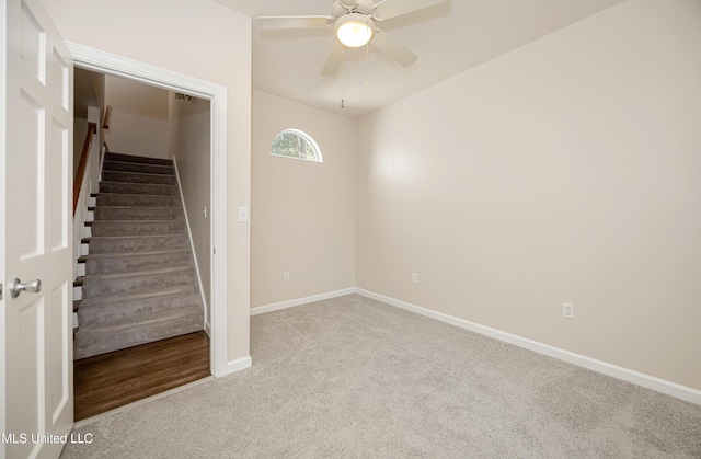 unfurnished room featuring light colored carpet and ceiling fan