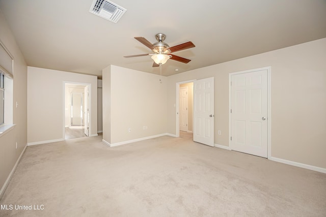 unfurnished bedroom featuring ceiling fan and light colored carpet